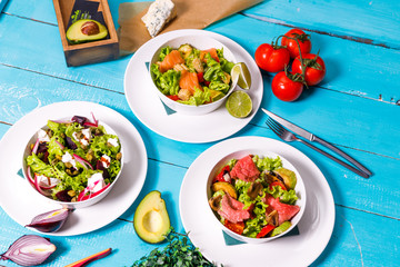 salad on a wooden blue table.