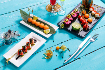 Catering. Away the food. snacks on blue wooden background. the view from the top