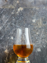 Irish Whiskey Glass on Wood and Slate Background Portrait