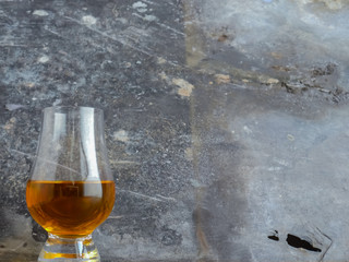 Irish Whiskey Glass on Wood and Slate Background Wide Shot