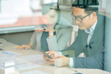 Colleagues reading text messages