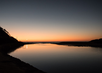 Naklejka premium sunrise on the lake inlet