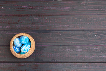 Colored easter eggs in a basket