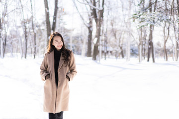 Portrait Young Beautiful asian woman smile happy travel and enjoy with snow winter season