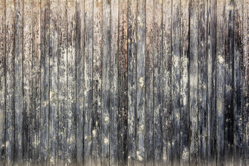 Old wooden background of narrow boards with cracked paint