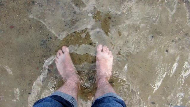 Male Feet Standing and Walking on Sandy Beach POV Slow Motion