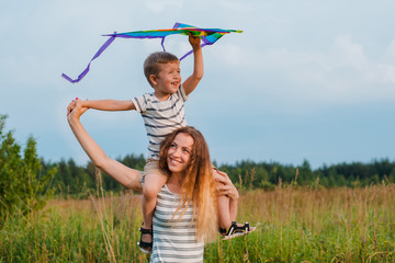 Mom and son play actively and have fun outdoors.