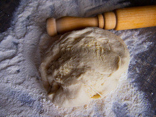 freshly prepared dough and flour