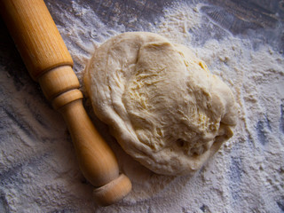 freshly prepared dough and flour