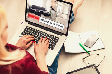 Apartment search online concept: house search application on a laptop screen