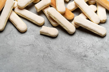 Italian Savoiardi ladyfingers Biscuits on concrete backgound