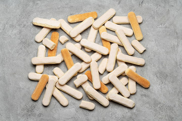 Italian Savoiardi ladyfingers Biscuits on concrete backgound