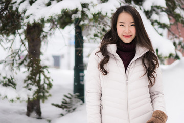 Beautiful young asian woman smile and happy with travel trip in Otaru canal Hokkaido Japan