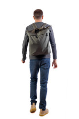 Fototapeta premium back view of walking man with green bag.