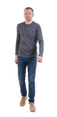 Fototapeta premium Front view of going handsome man.