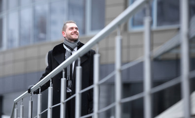 businessman in a winter coat ,rising to the office