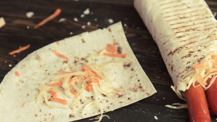 sausages in pita bread on the table by the chef
