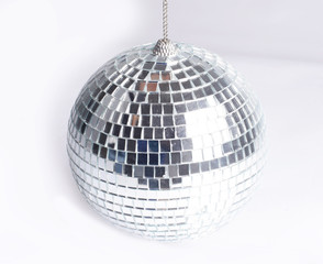 closeup .hand holding a mirror ball.isolated on gray background