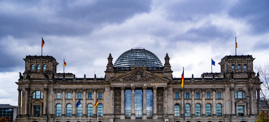 Reichstag building in Berlin, Germany. Dedication on the frieze means "To the German people".