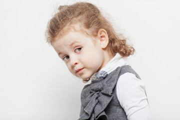 Cute little girl, close-up, light background