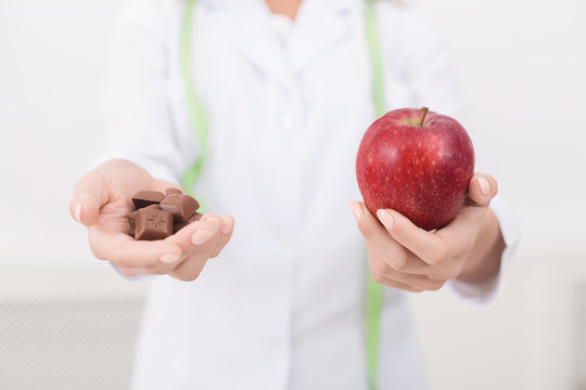 Nutritionist offering nutritious apple as alternative to chocolate