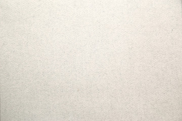 Light gray  brown background with streaks and particles