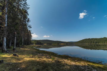 Impressively beautiful Fairy-tale mountain lake with crystal clear water Breathtaking Scene. 