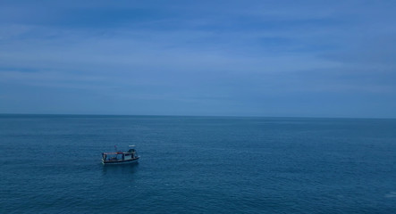 Fishing boat on the sea with blue sky