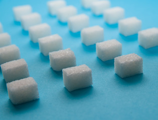 Sugar squares on blue background.