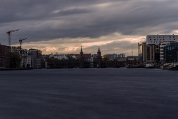 Fototapeta premium historical Oberbaum bridge (Oberbaumbruecke) and the river Spree in Berlin, Germany, Europe, vintage filtered style