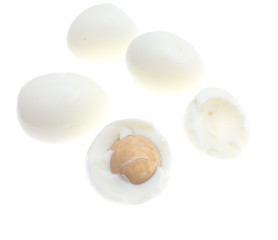 Peeled boiled eggs on a white background