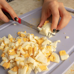 Cutting boiled eggs in the kitchen