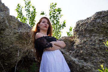 portrait of young redhead woman in dress 