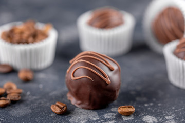 Homemade sweets with coffee filling on a dark background. Homemade candy. Macro.