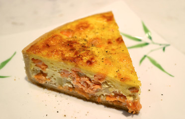 Plate of Salmon and Onion Quiche Served on White Table