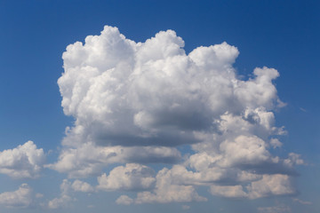 Naklejka na ściany i meble view on cumulus clouds in a blue sky