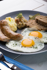 German breakfast on a grey plate
