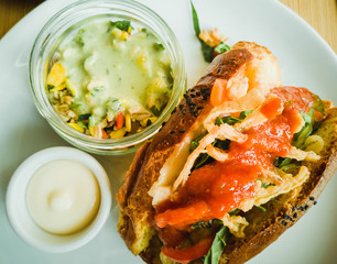 Breakfast sandwich with salad and sauce