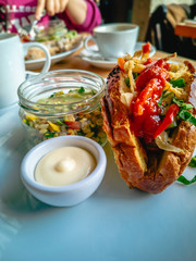 Breakfast corn bread sandwich  with salad and sauce