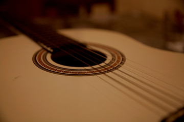 Fototapeta premium Playing the guitar concept. Musical instrument close up. 