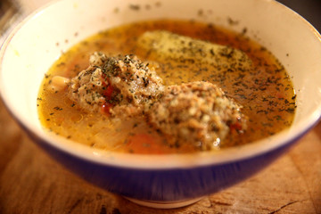 Traditional Azerbaijani Kufta bozbash - pea soup with lamb meatballs, made of minced meat and rice, zesty dried plum inside and boiled potatoes topped with dried mint and sumac 