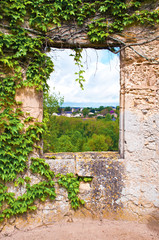 Obraz premium View on small town Montreuil-Bellay through a window opening