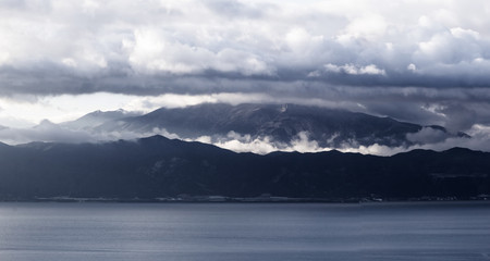 Panoramic view of sea, mountains and clouds in Greece.