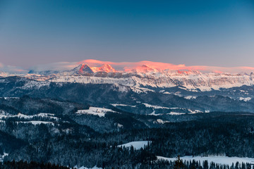 Alpenglow in winter on Eiger Mönch and Jungfrau in the Bernese Alps