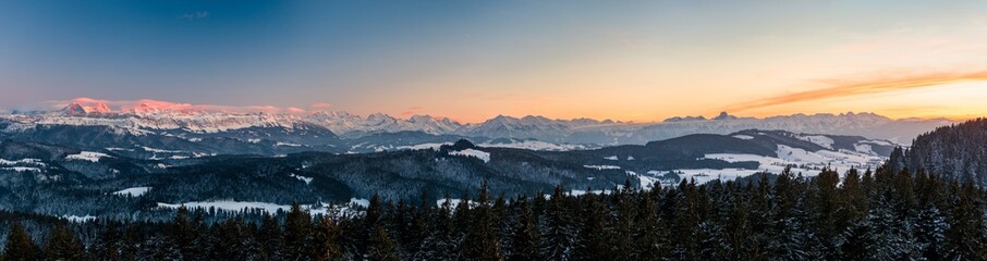 winter sunset panorama of the Bernese Alps including Eiger Mönch Jungfrau, Niesen and Stockhorn