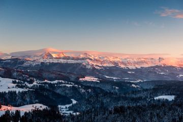 Alpenglow in winter on Eiger Mönch and Jungfrau in the Bernese Alps