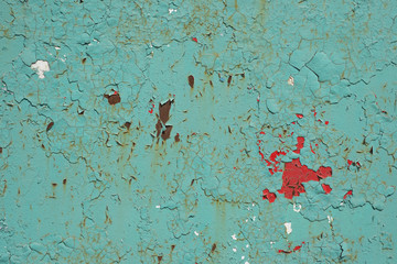 Old rusty iron sheet covered by old blue paint. Abstract background