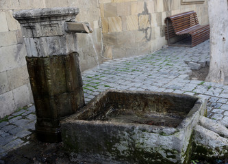 Obraz na płótnie Canvas Old stone water fountain