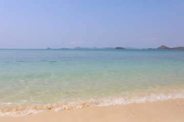 Beautiful sandy beach and soft blue ocean wave