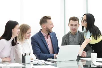 business team discussing online information in a modern office